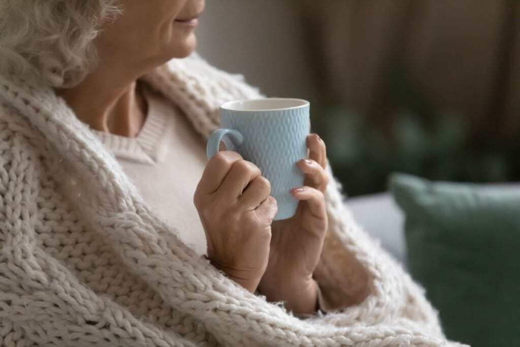 Elderly person cup of tea warm